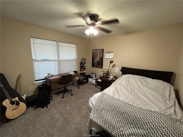 a bed room with a bed and a couch