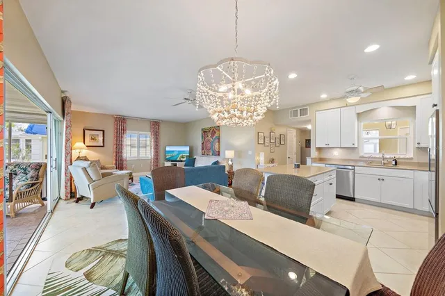 a large kitchen with a table and chairs