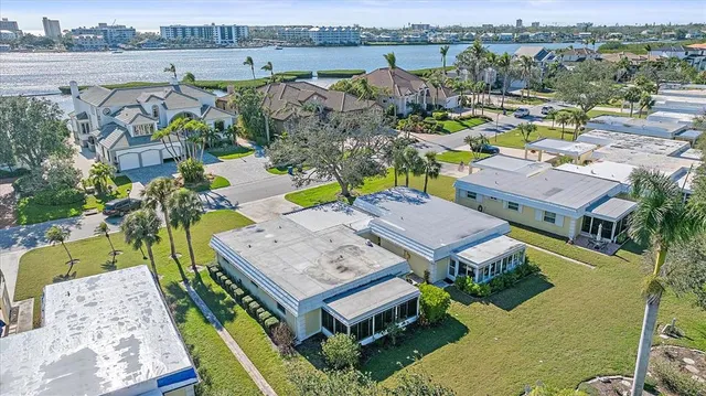 an aerial view of a house with big yard