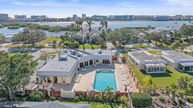 an aerial view of residential houses and lake