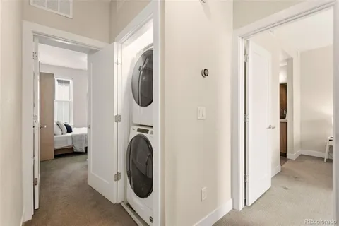 a bedroom with bed and large window
