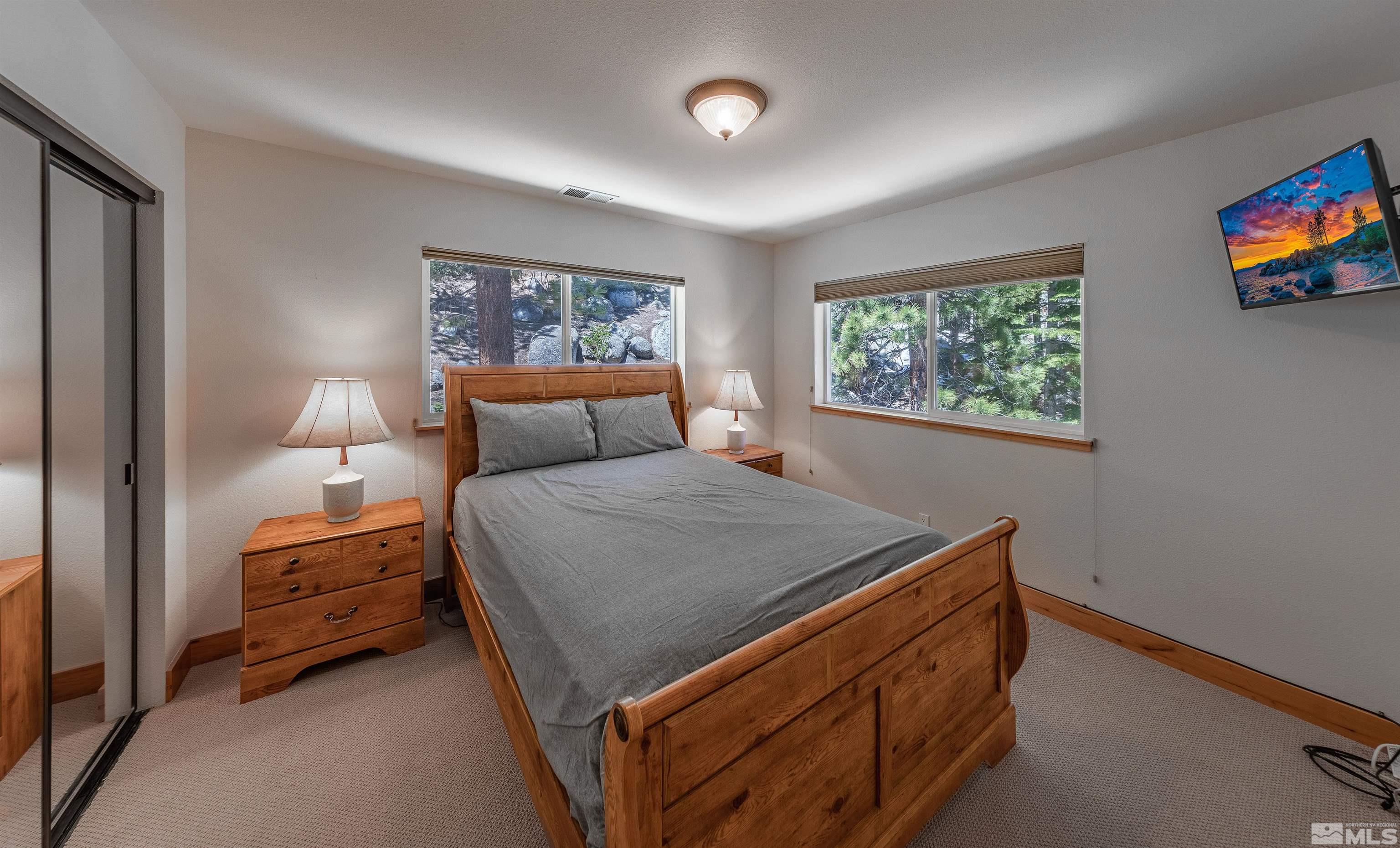 278 Andria Drive Stateline, NV 89449 - Photo 18 of 37 a bedroom with a bed and a painting on the wall