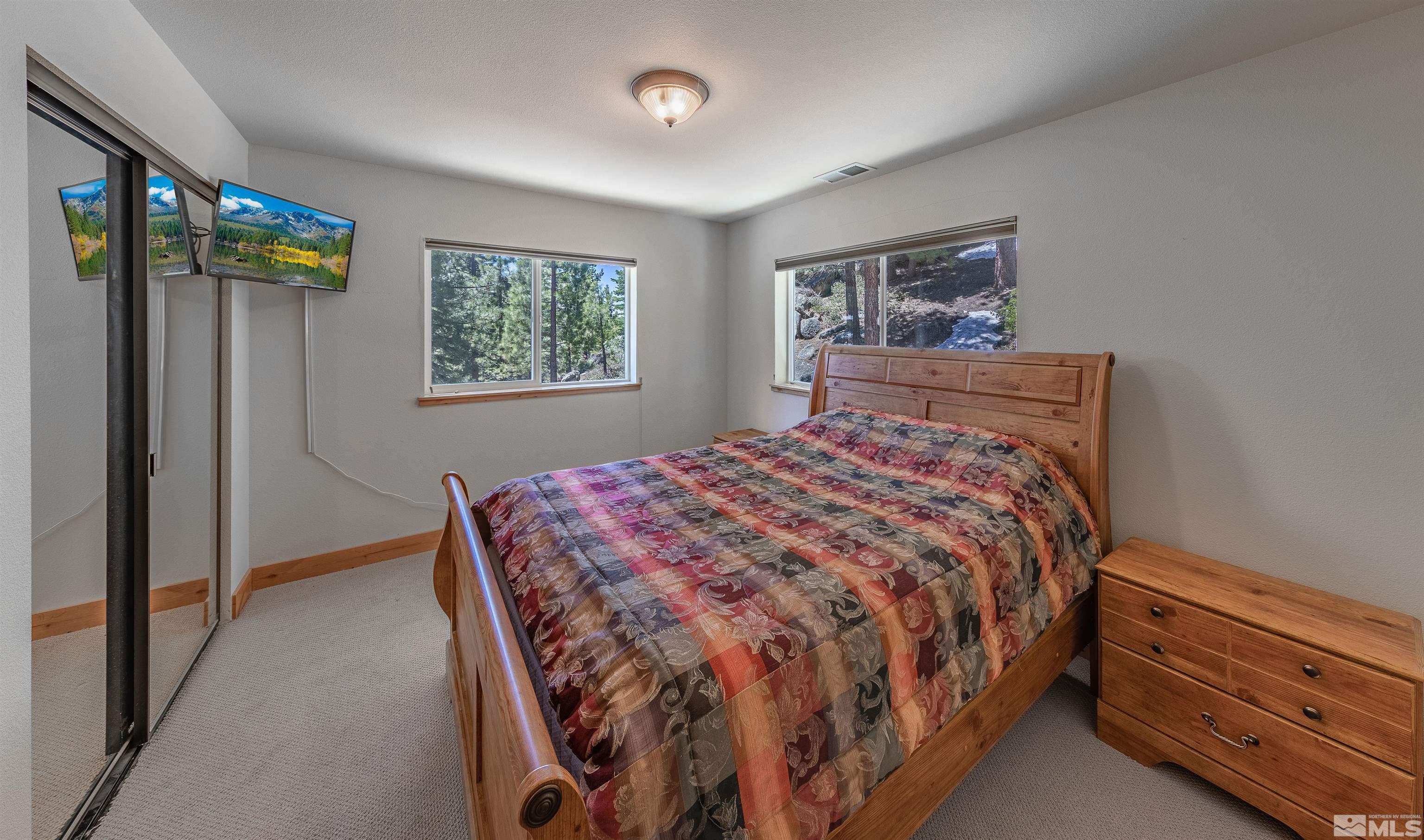 278 Andria Drive Stateline, NV 89449 - Photo 19 of 37 a bedroom with a bed and a window