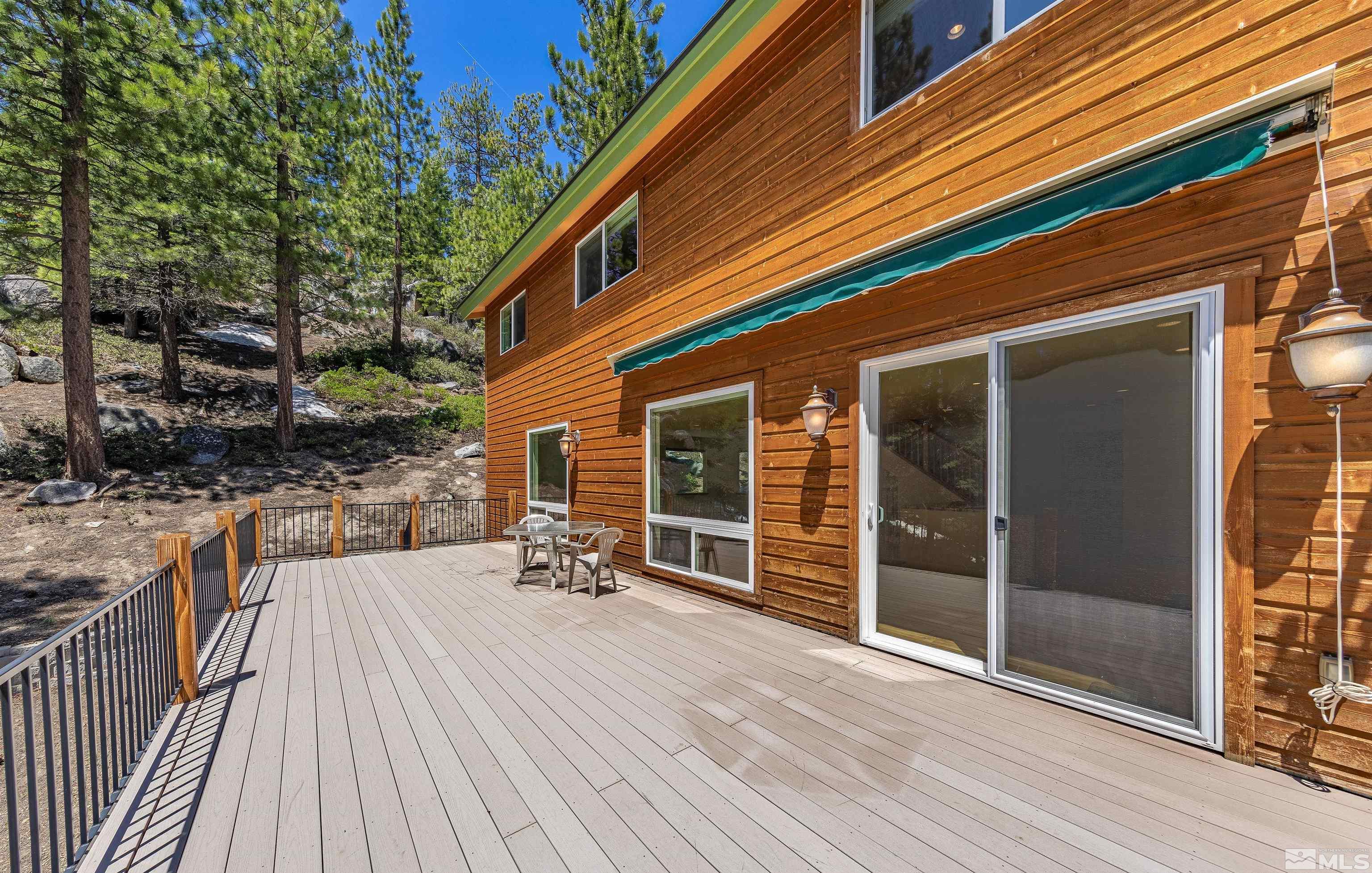 278 Andria Drive Stateline, NV 89449 - Photo 9 of 37 a view of a house with a barbeque and wooden stairs