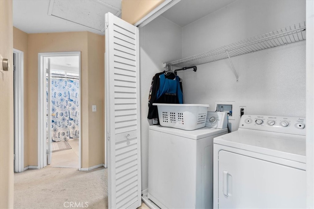 1474 Albillo Loop Perris, CA 92571 - Photo 26 of 35 a utility room with dryer and washer