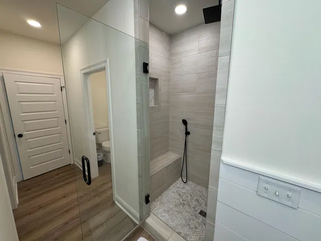 a bathroom with a shower and a sink
