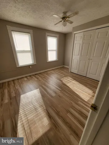 a view of an empty room with windows