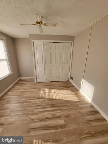 a view of a livingroom with wooden floor