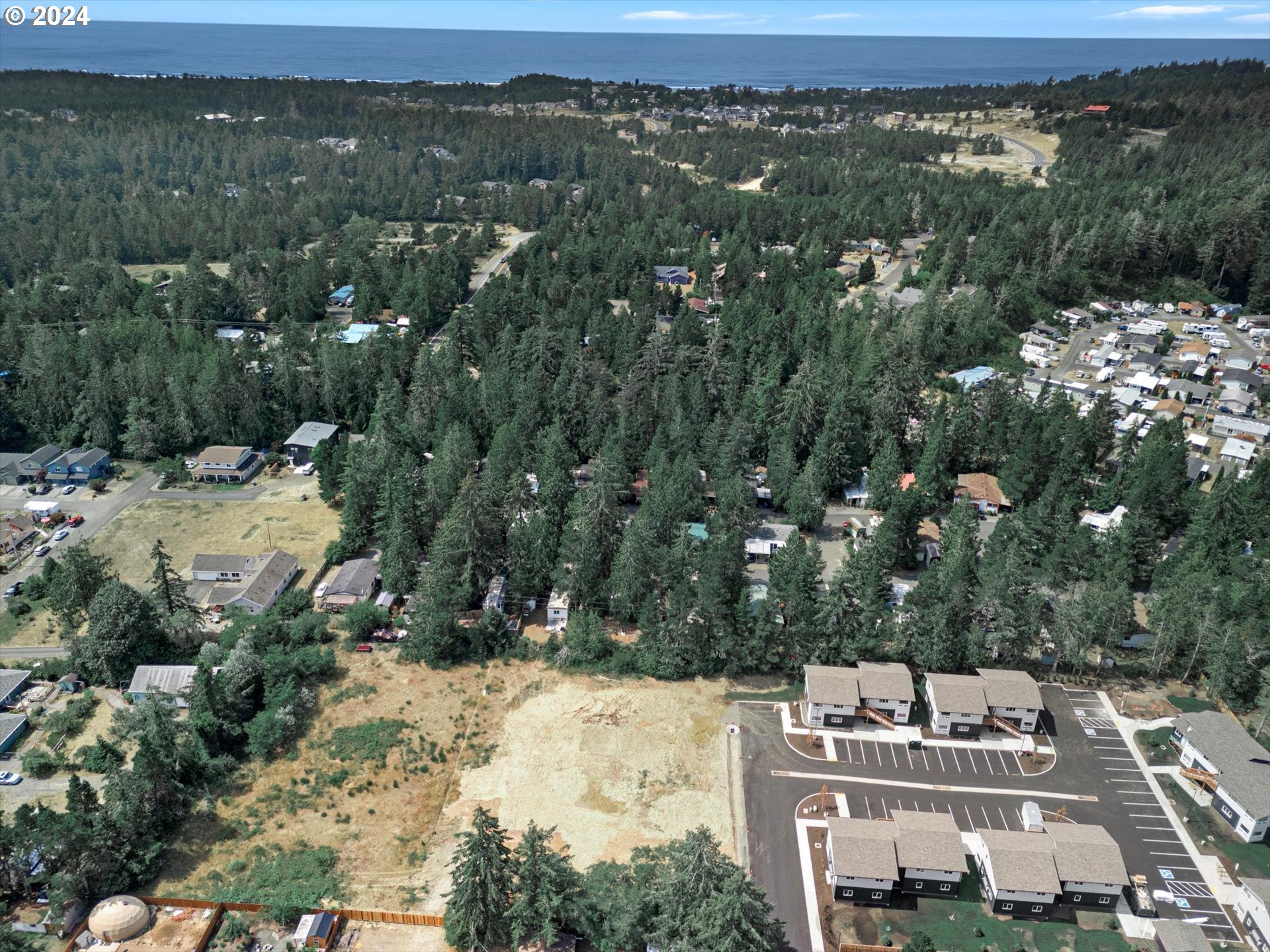35340 Bayside Gardens Road Nehalem, OR 97131 - Photo 4 of 23 an aerial view of residential houses with outdoor space