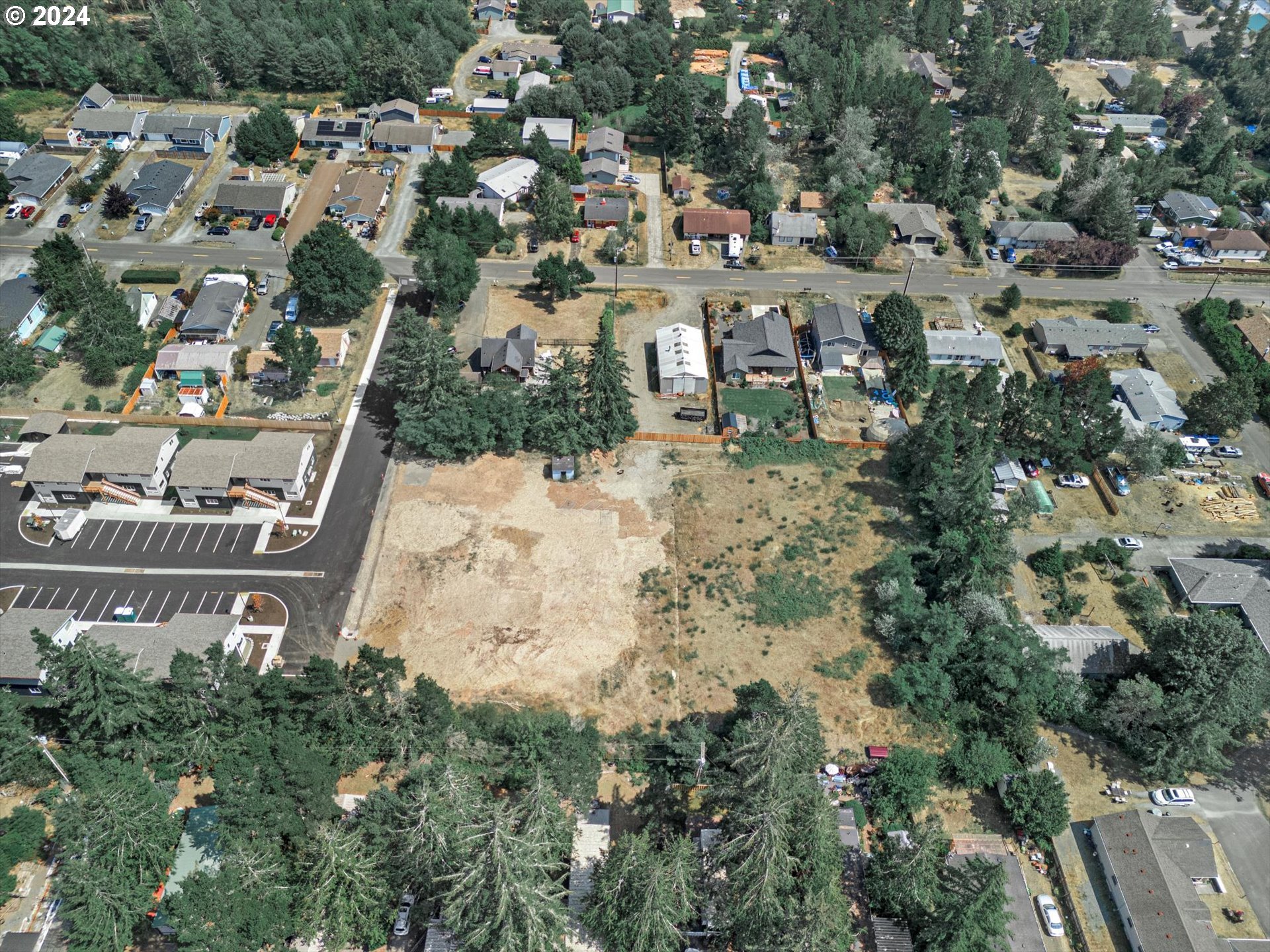35340 Bayside Gardens Road Nehalem, OR 97131 - Photo 8 of 23 an aerial view of a house with a yard and lake view
