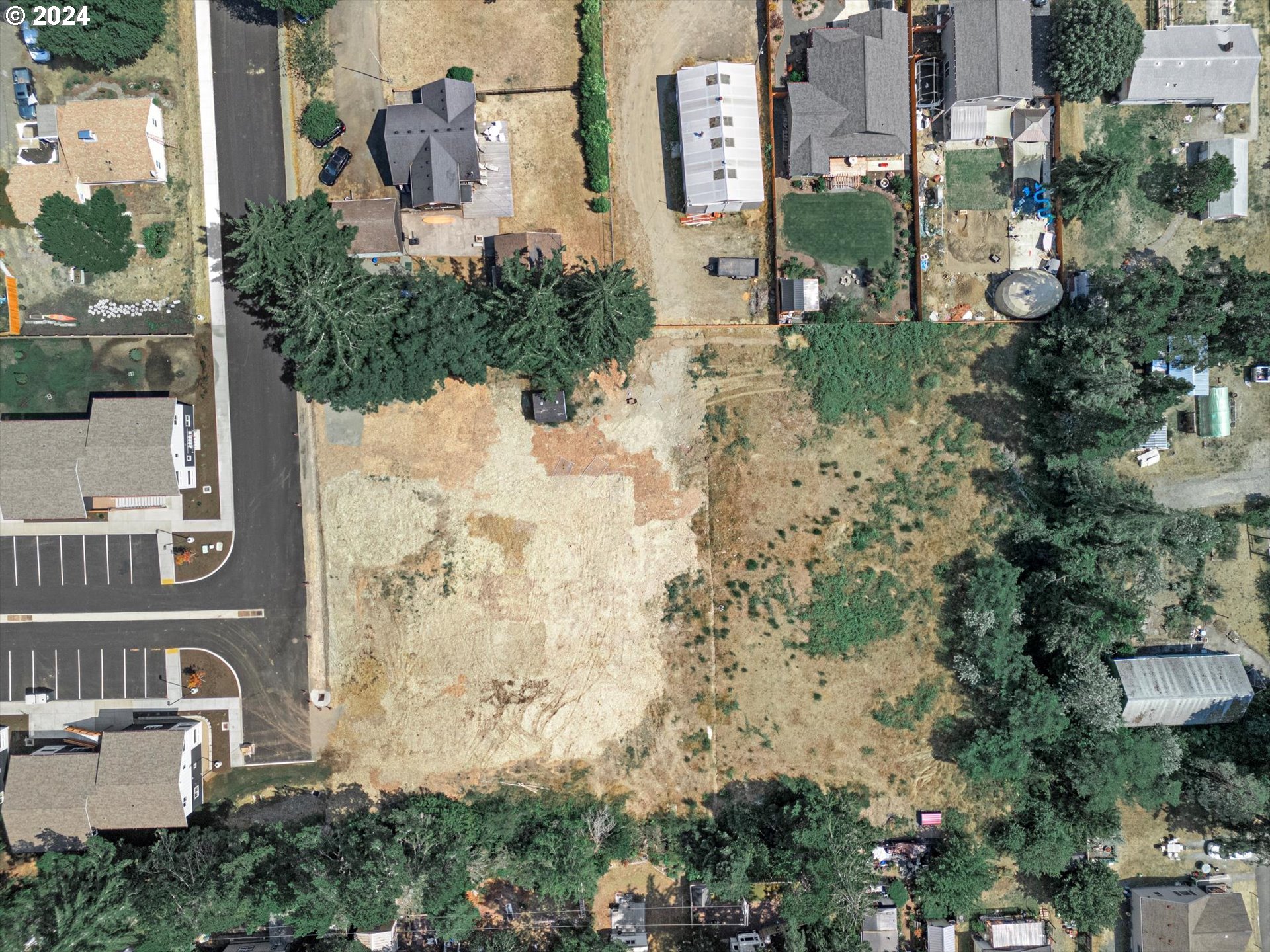 35340 Bayside Gardens Road Nehalem, OR 97131 - Photo 9 of 23 an aerial view of waterside residential houses with outdoor space