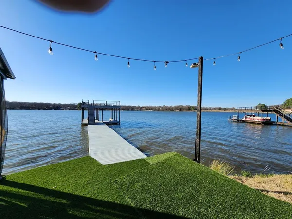a view of a backyard with sitting area