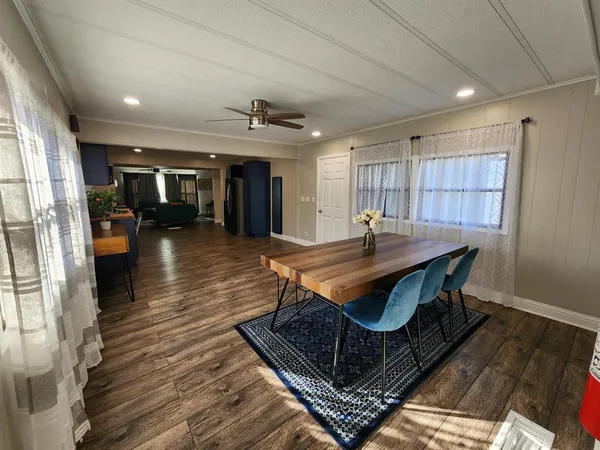 a kitchen with stainless steel appliances granite countertop a sink a stove and refrigerator