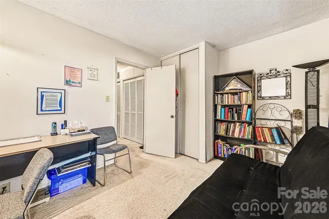 a view of a workspace with furniture and toys