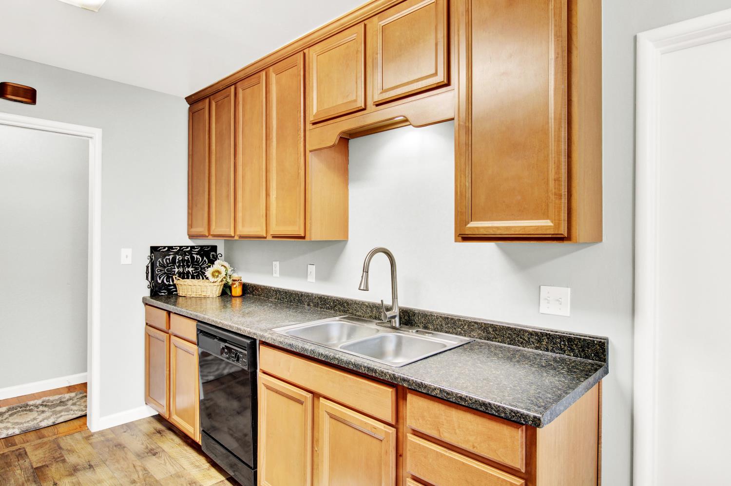 1530 Morene Way Modesto, CA 95355 - Photo 11 of 38 a kitchen with stainless steel appliances granite countertop a sink stove and refrigerator