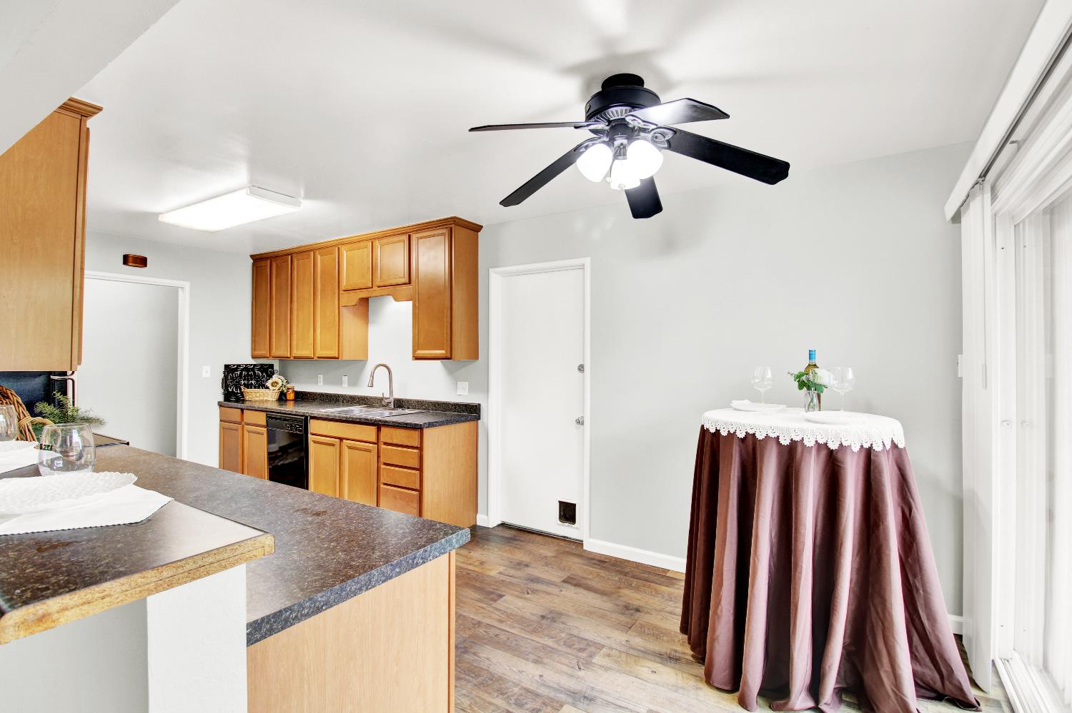 1530 Morene Way Modesto, CA 95355 - Photo 13 of 38 a kitchen with stainless steel appliances granite countertop a sink a stove and a refrigerator