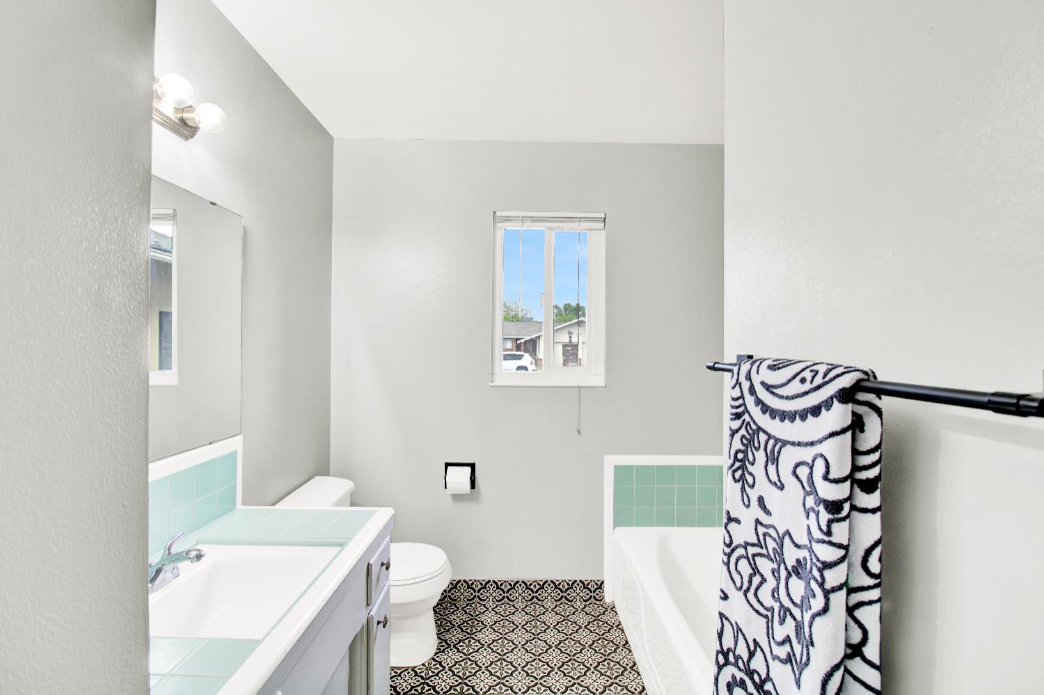 1530 Morene Way Modesto, CA 95355 - Photo 18 of 38 a bathroom with a sink a toilet and a shower curtain