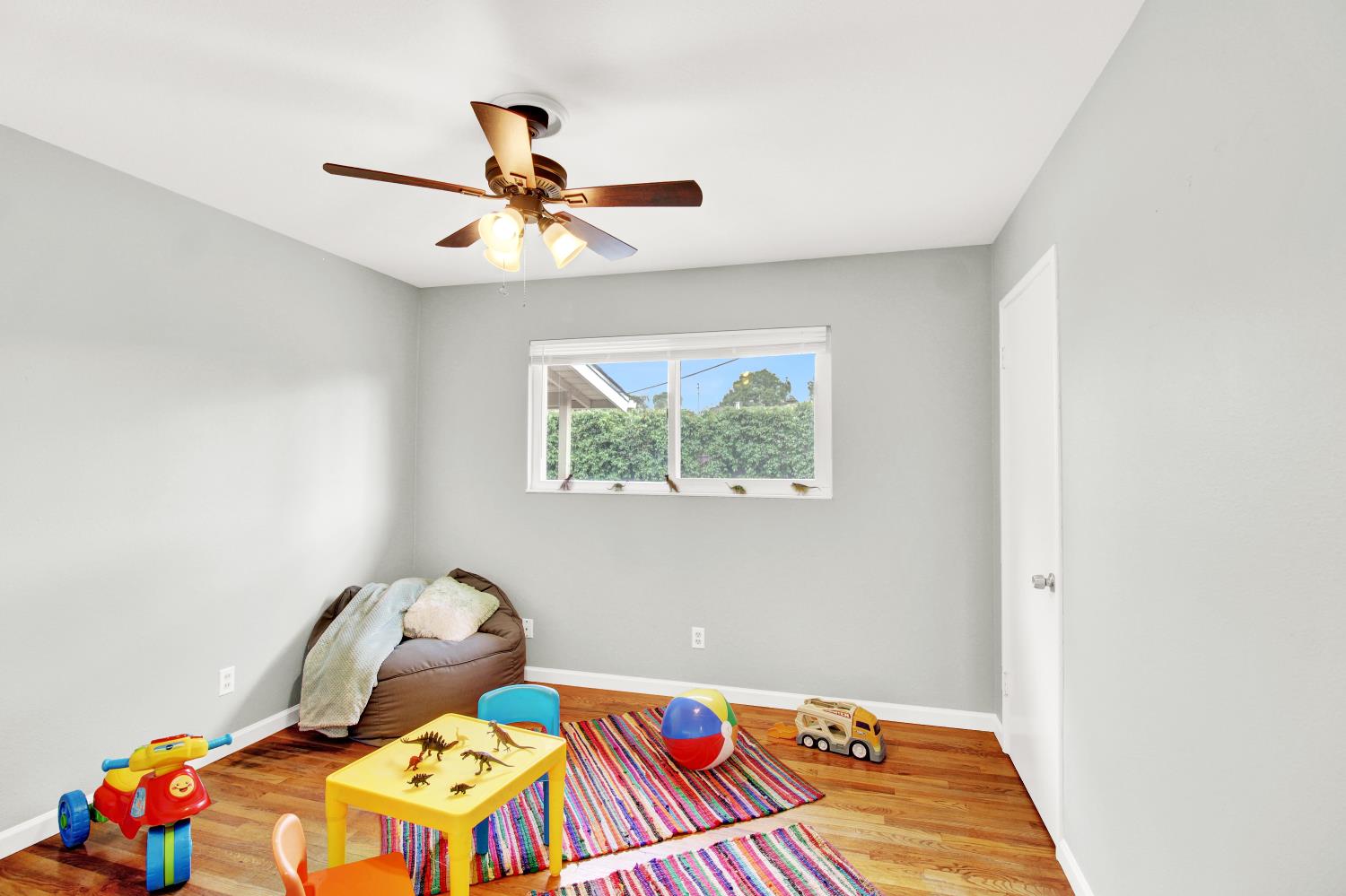 1530 Morene Way Modesto, CA 95355 - Photo 20 of 38 a bedroom with a bed and wooden floor