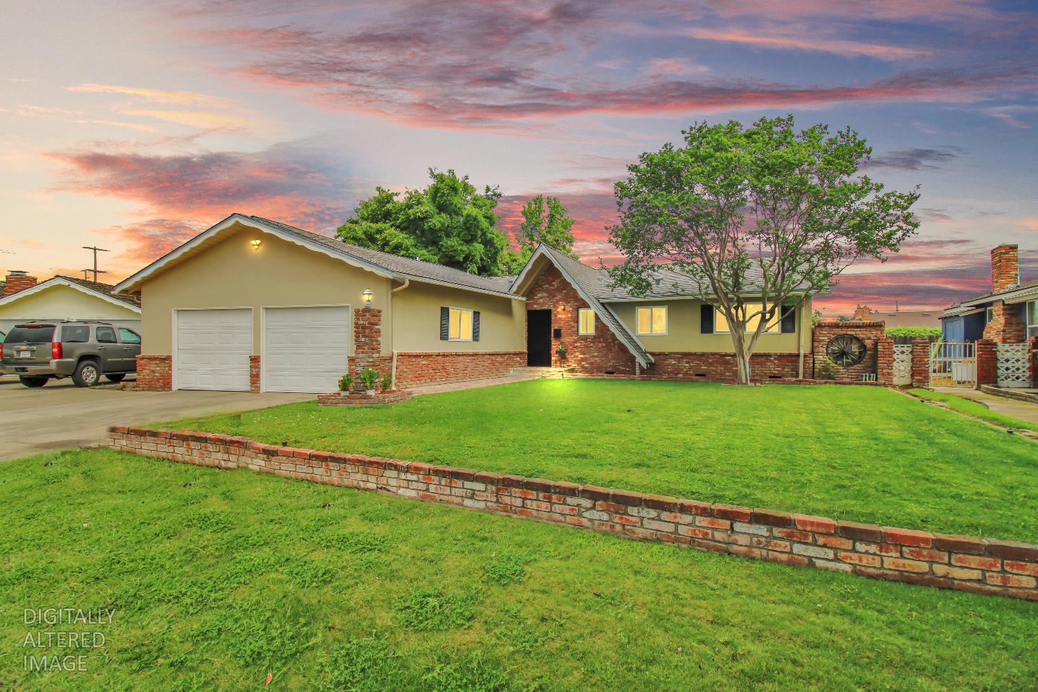 1530 Morene Way Modesto, CA 95355 - Photo 2 of 38 a front view of a house with a yard