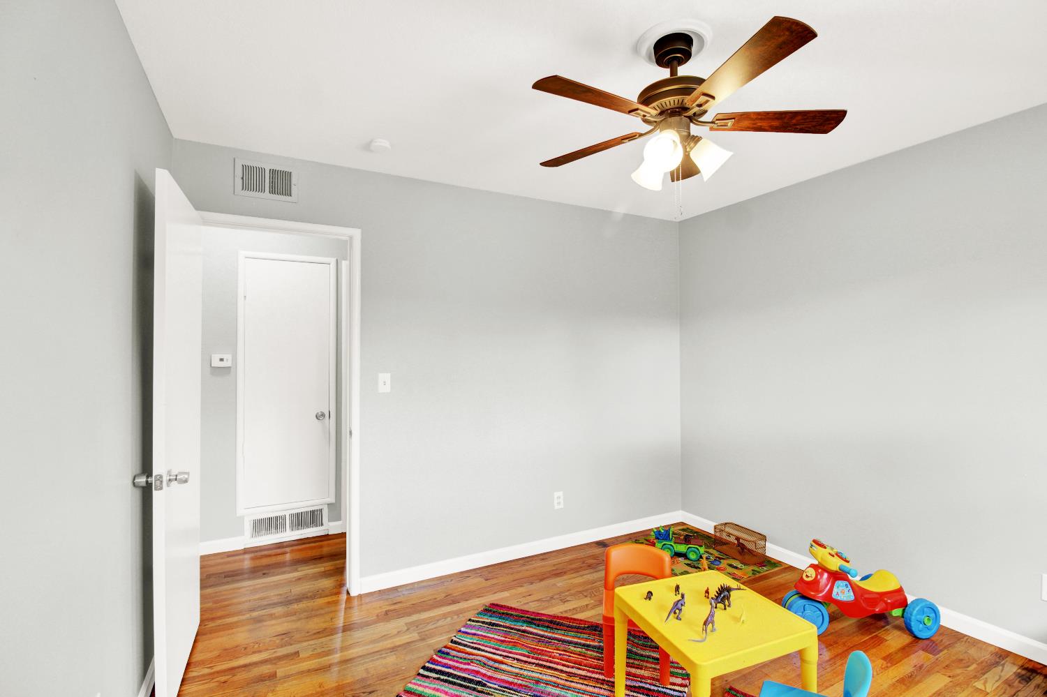 1530 Morene Way Modesto, CA 95355 - Photo 23 of 38 a bedroom with a bed and a chandelier