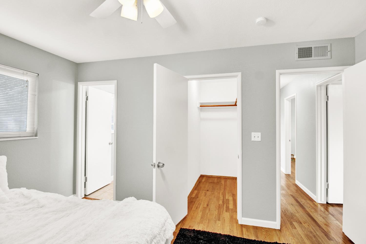 1530 Morene Way Modesto, CA 95355 - Photo 27 of 38 a bedroom with a bed and wooden floor