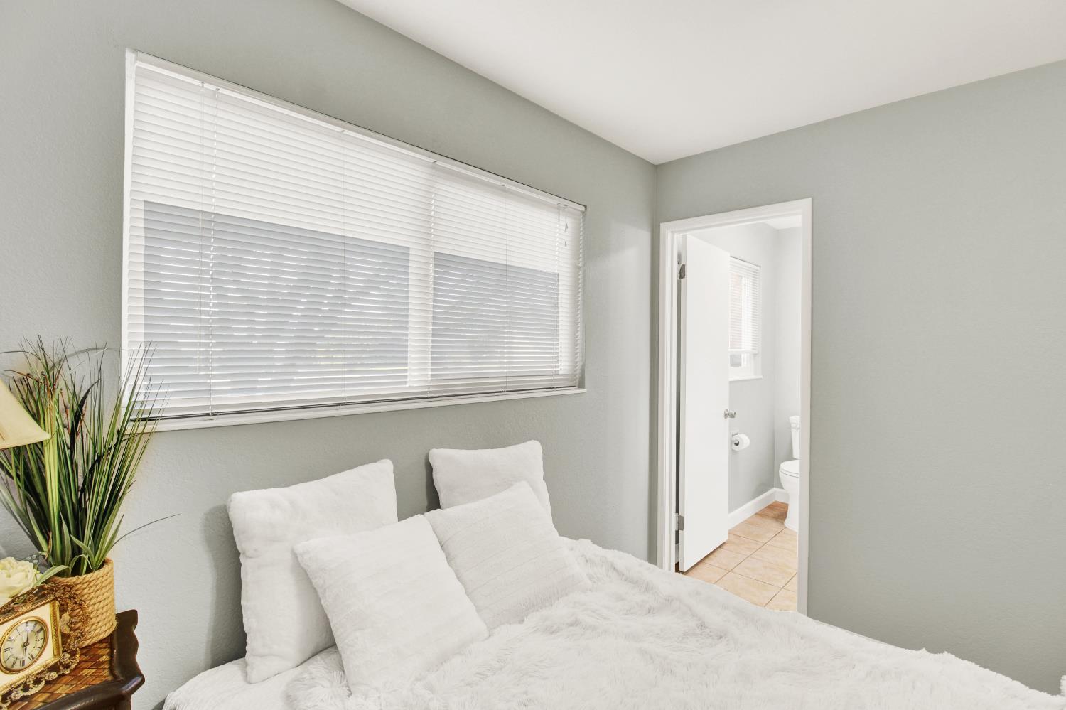 1530 Morene Way Modesto, CA 95355 - Photo 28 of 38 a view of a bedroom with furniture and windows