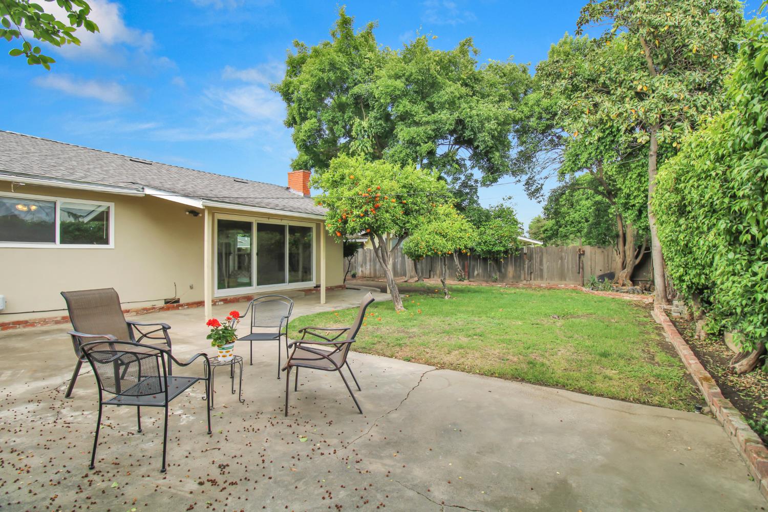 1530 Morene Way Modesto, CA 95355 - Photo 32 of 38 a garden with a bench and some trees