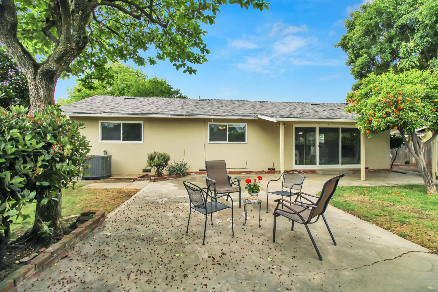 1530 Morene Way Modesto, CA 95355 - Photo 33 of 38 a view of a house with backyard sitting area and garden