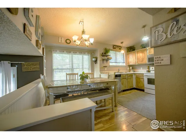 a kitchen with a sink stainless steel appliances cabinets and a counter top space