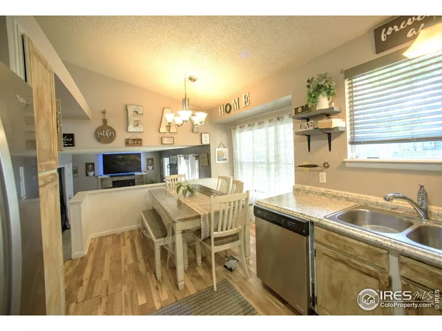 a kitchen with a table and chairs