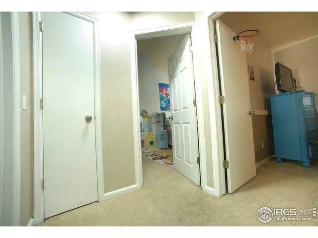 a view of a hallway with a dining room