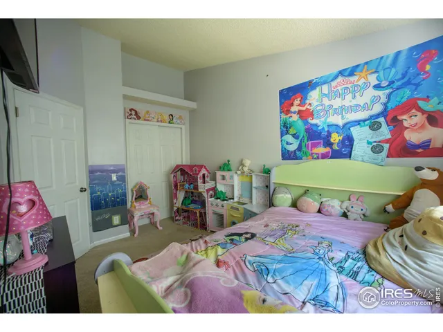 a bedroom with furniture and a wooden floor