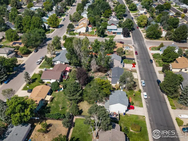 an aerial view of house with yard