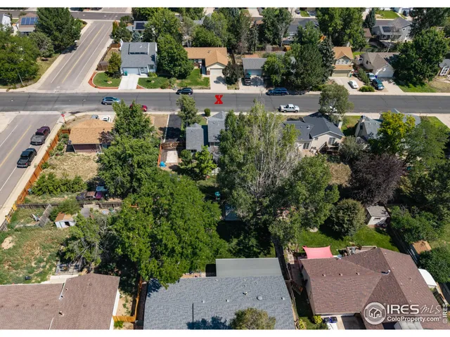 an aerial view of a house with yard swimming pool and outdoor seating