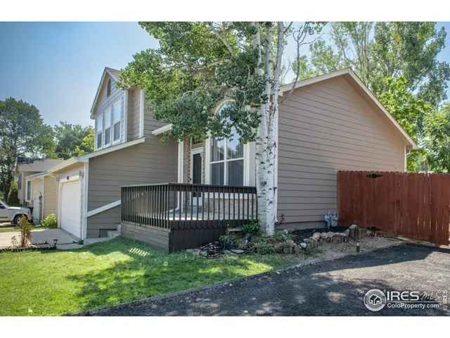 a view of backyard with a garden and deck