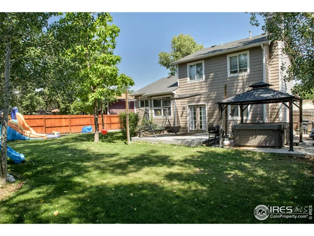 a view of house with a yard