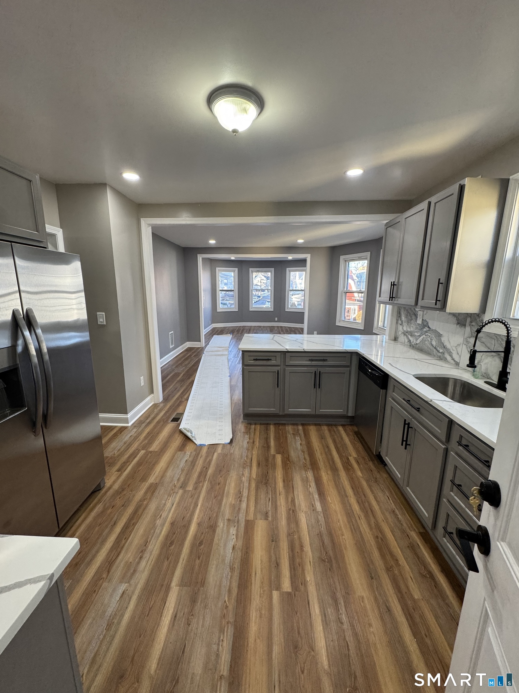 399 Hawley Avenue Bridgeport, CT 06606 - Photo 6 of 11 a kitchen with sink refrigerator and window