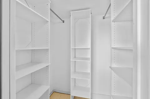 a view of an empty walk in closet
