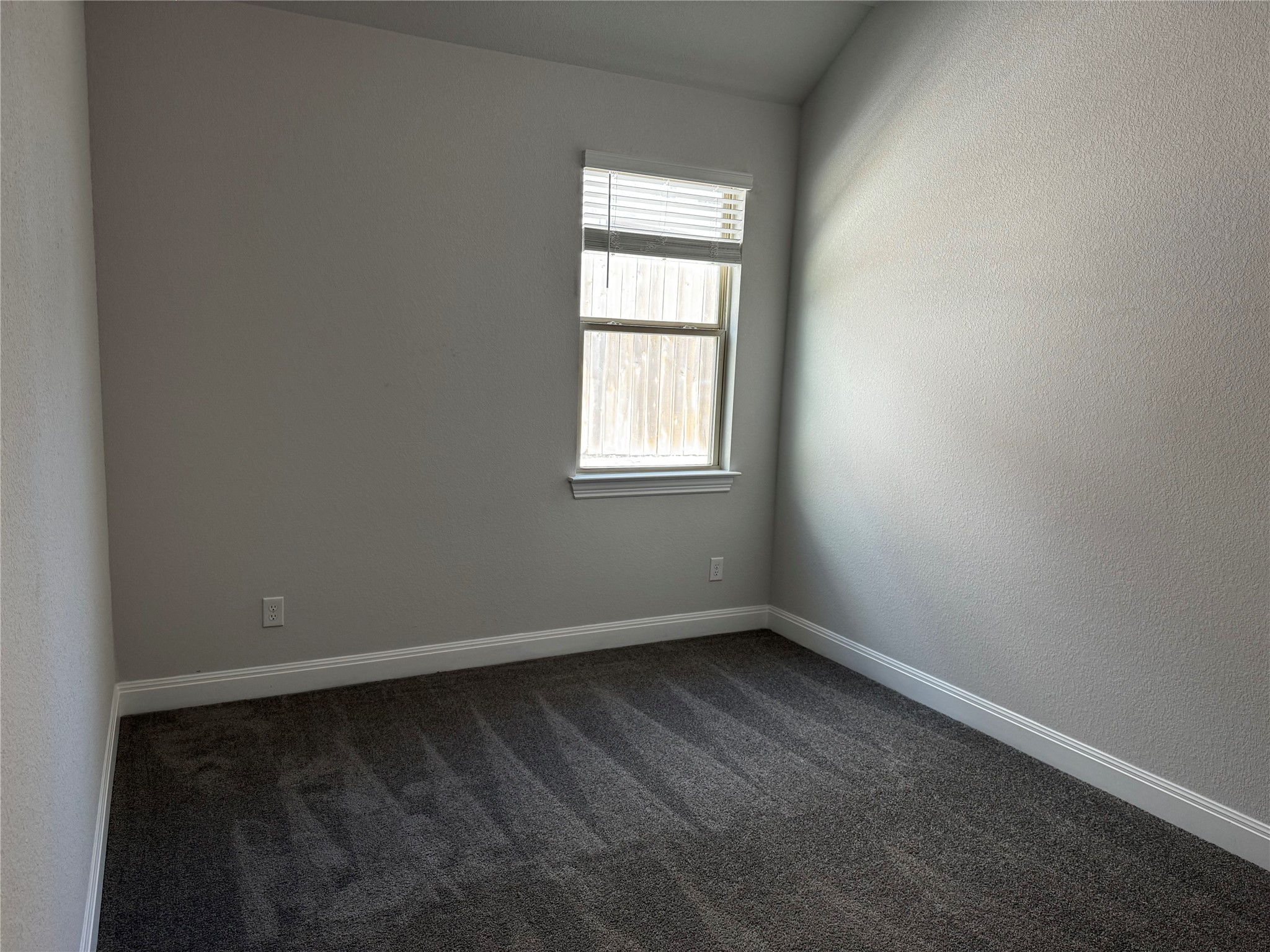 1432 Ridge Runner Drive Georgetown, TX 78628 - Photo 22 of 27 Unfurnished room with dark carpet and a textured wall
