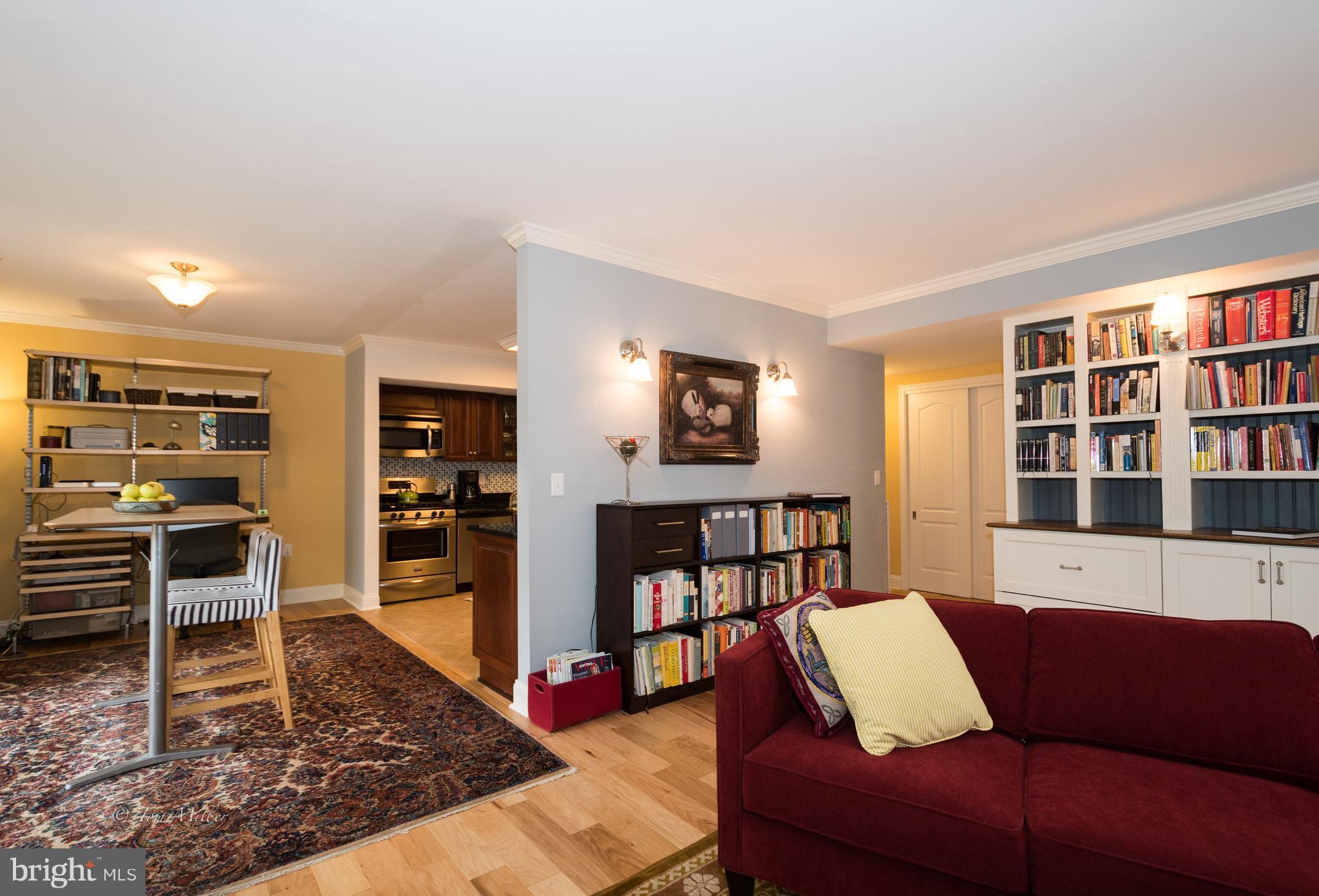 118 Cross Keys Road, Unit R118A Baltimore, MD 21210 - Photo 20 of 20 a living room with furniture and a book shelf