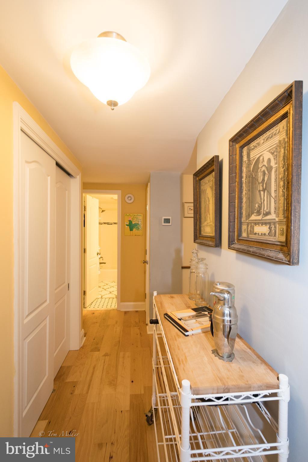 118 Cross Keys Road, Unit R118A Baltimore, MD 21210 - Photo 16 of 20 a view of a kitchen with a sink and wooden floor