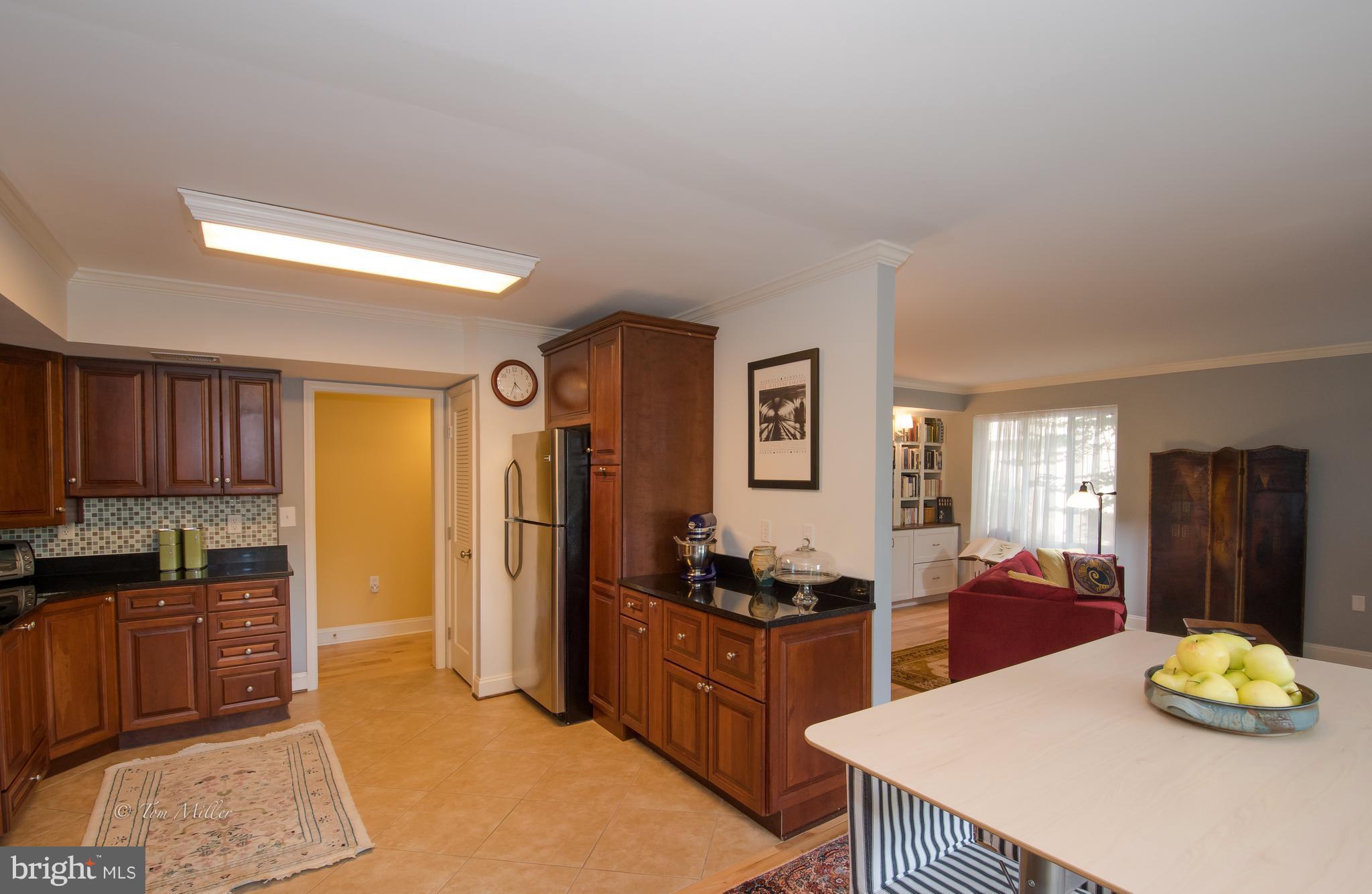 118 Cross Keys Road, Unit R118A Baltimore, MD 21210 - Photo 2 of 20 a kitchen with a refrigerator and a stove