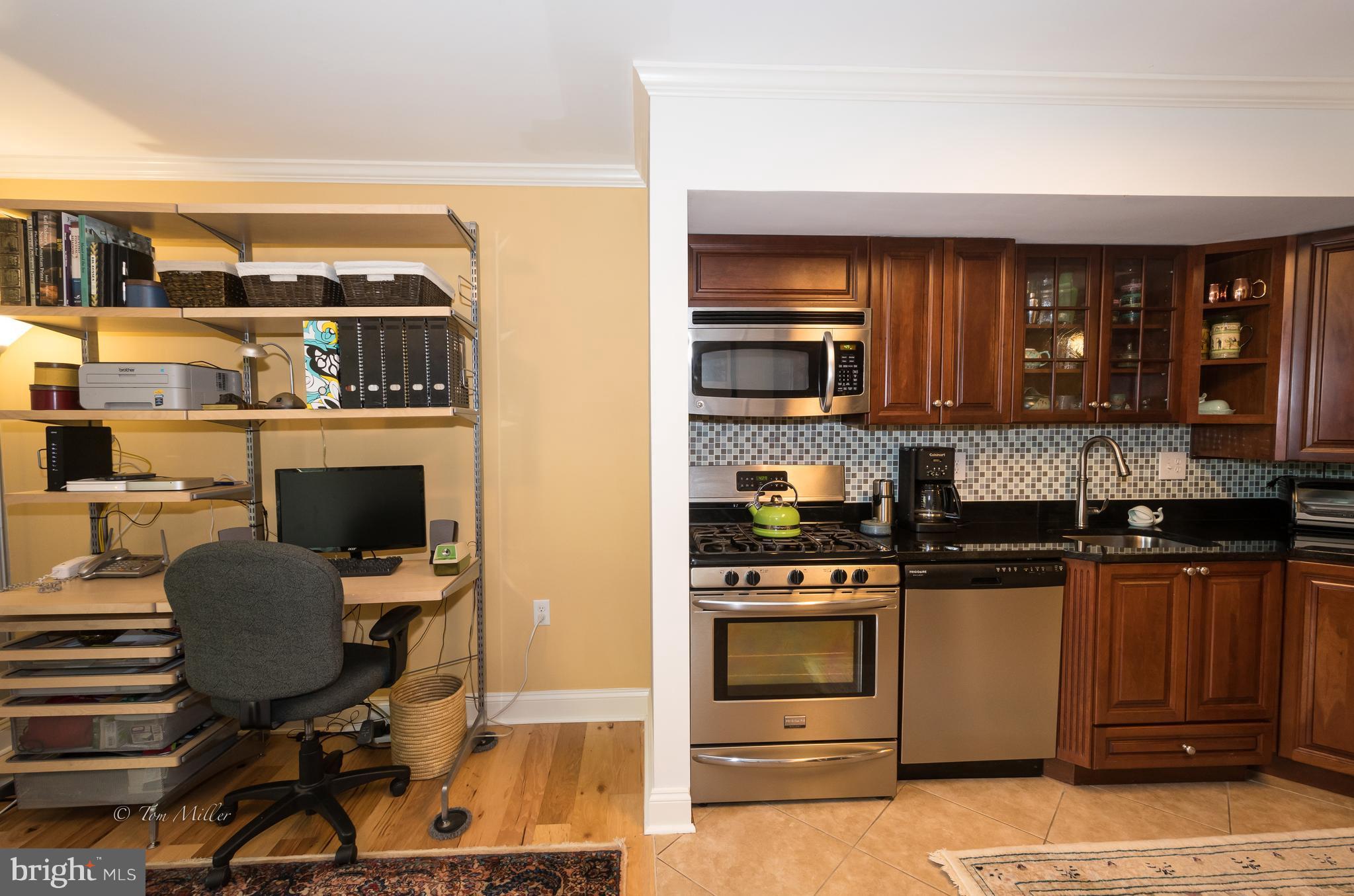 118 Cross Keys Road, Unit R118A Baltimore, MD 21210 - Photo 3 of 20 a kitchen with a stove and a refrigerator