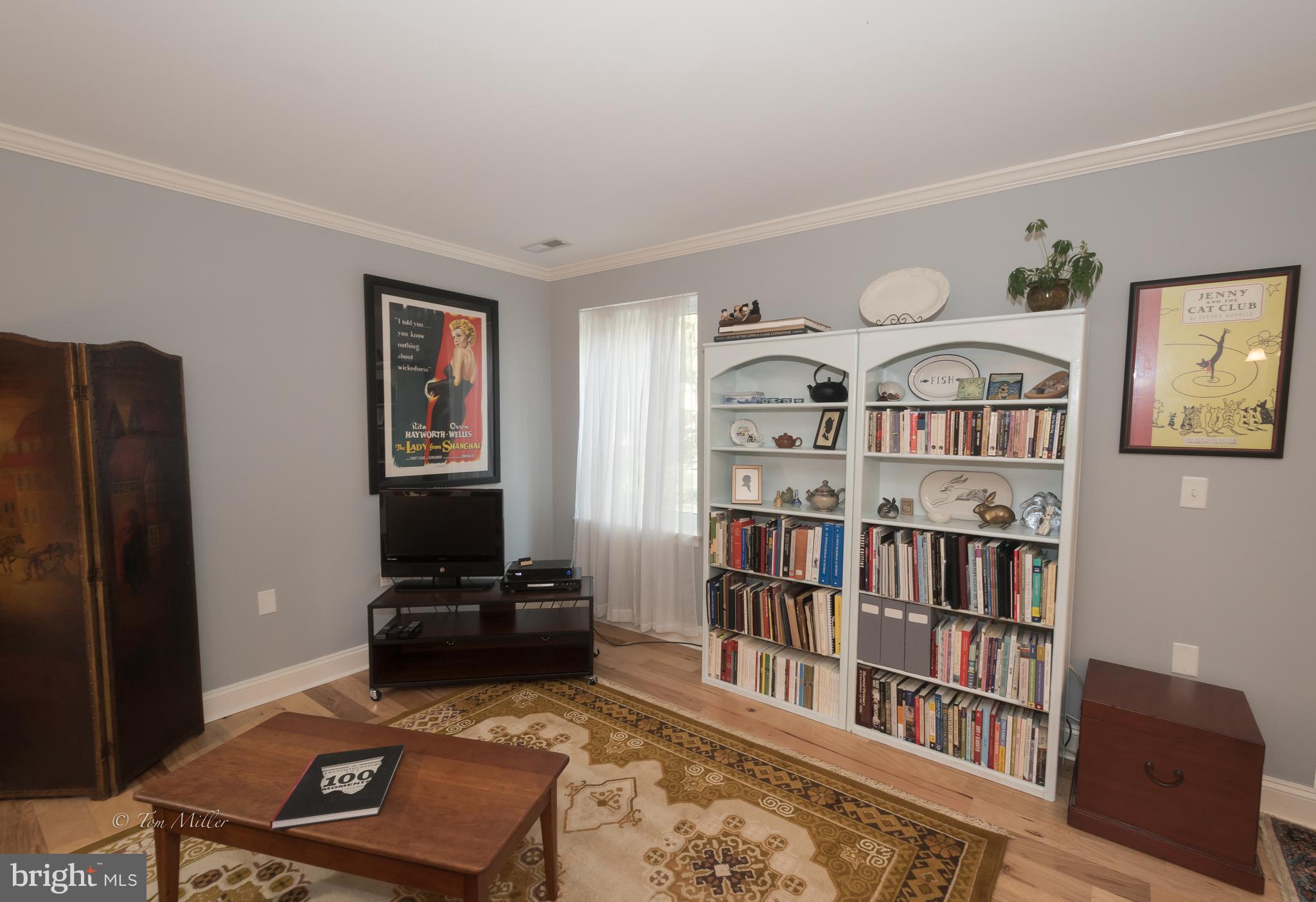 118 Cross Keys Road, Unit R118A Baltimore, MD 21210 - Photo 5 of 20 a living room with furniture and a book shelf