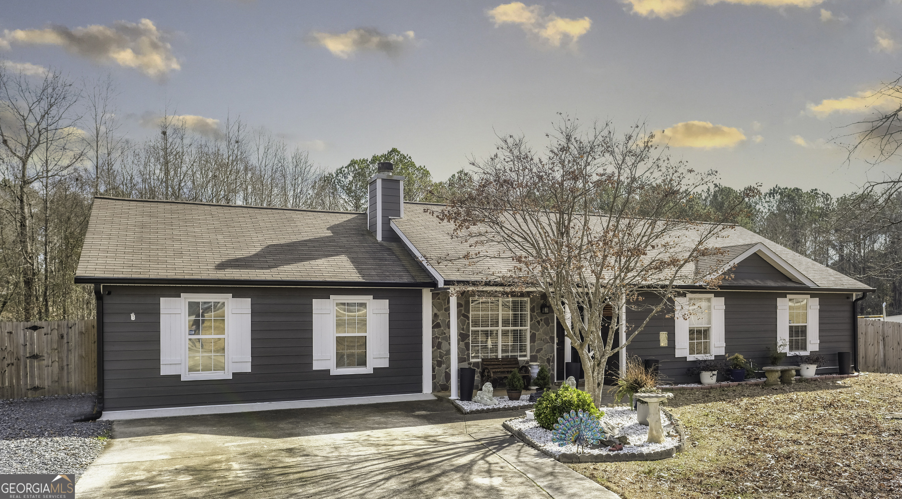 367 Old Carrollton Road Newnan, GA 30263 - Photo 1 of 1 a front view of a house with large garden