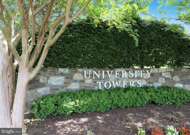 a view of sign board with plants