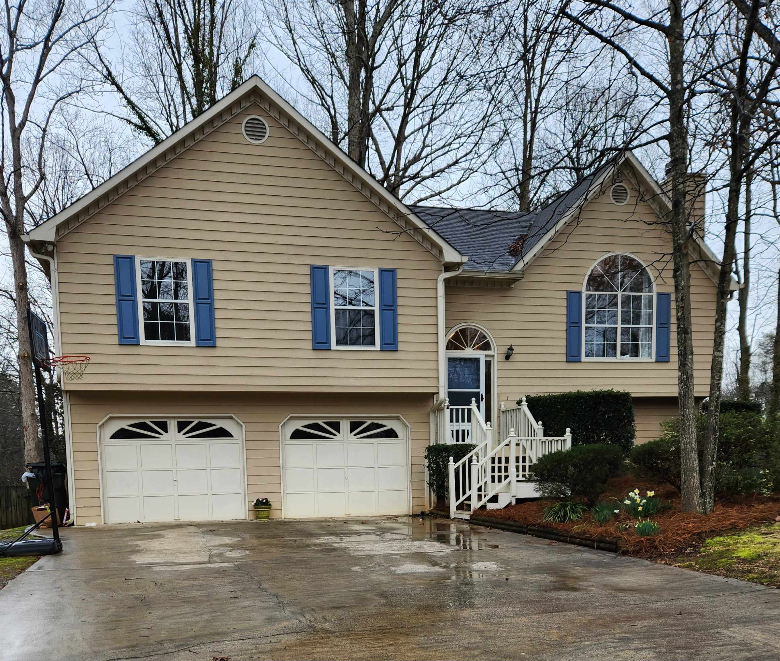 a front view of a house with garage