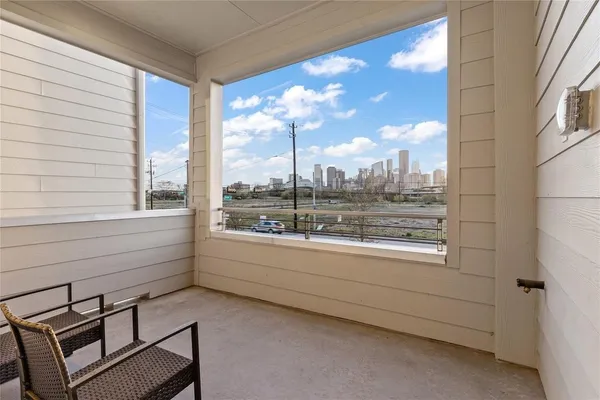 a view of a room with window and furniture