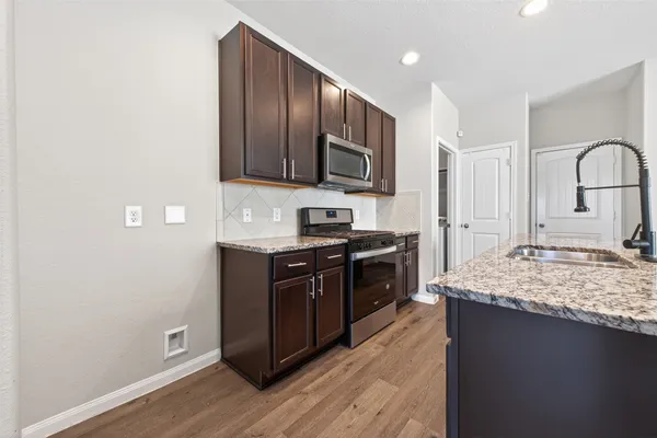 a bathroom with a toilet and bathtub