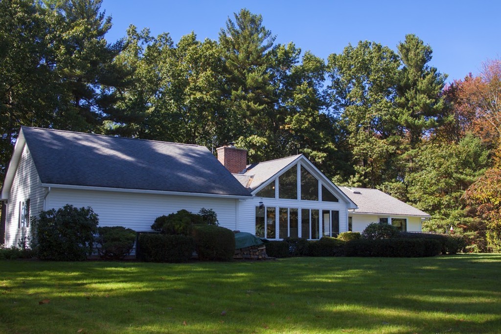 1170 Florence Road Northampton, MA 01062 - Photo 1 of 25 a front view of a house with a garden